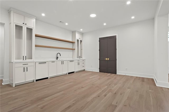 4785 Merlendale Ct, Atlanta, GA 30327 - bar featuring light wood-type flooring, baseboards, white dishwasher, recessed lighting, and a sink