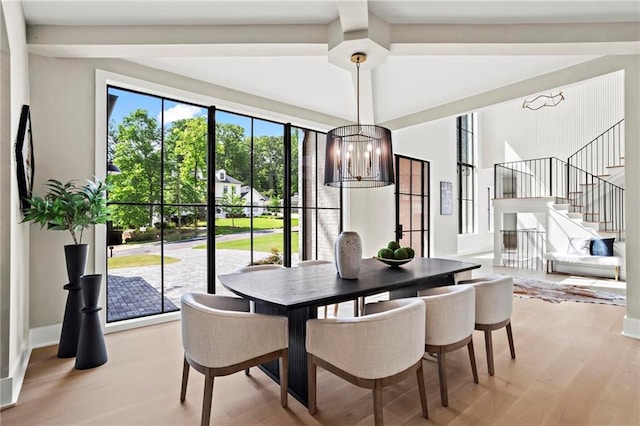 4785 Merlendale Ct, Atlanta, GA 30327 - dining room featuring light wood-style floors, stairs, and a chandelier