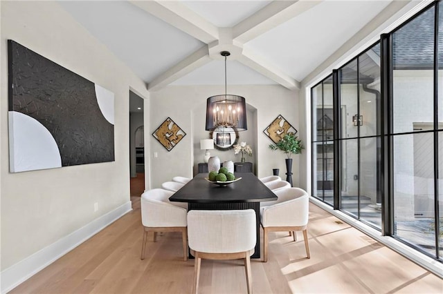 4785 Merlendale Ct, Atlanta, GA 30327 - dining area with a chandelier, beam ceiling, light wood-style floors, baseboards, and arched walkways