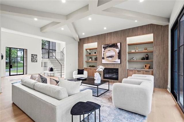 4785 Merlendale Ct, Atlanta, GA 30327 - living room with a fireplace, beam ceiling, light wood-type flooring, recessed lighting, and stairs