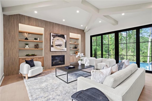 4785 Merlendale Ct, Atlanta, GA 30327 - living room with healthy amount of natural light, beam ceiling, recessed lighting, a large fireplace, and built in features