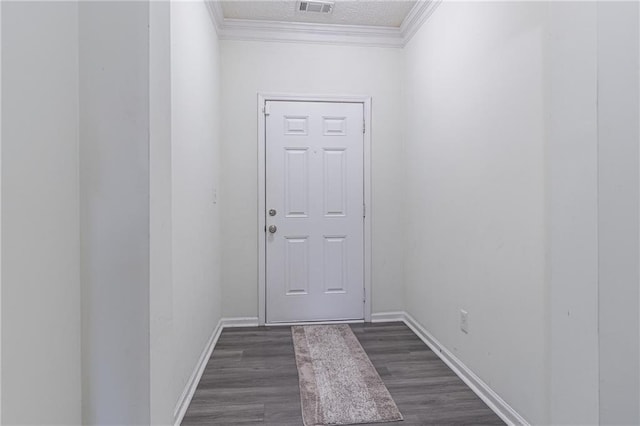 doorway with dark hardwood / wood-style flooring and ornamental molding