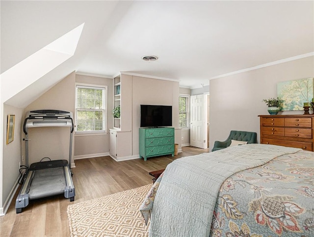 bedroom featuring hardwood / wood-style floors and lofted ceiling