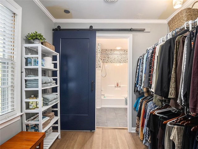 bathroom featuring wood-type flooring, vanity, and crown molding