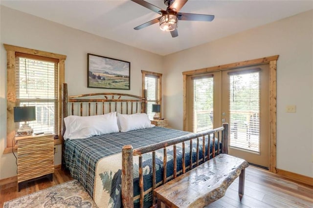 bedroom featuring baseboards, wood finished floors, a ceiling fan, and access to exterior