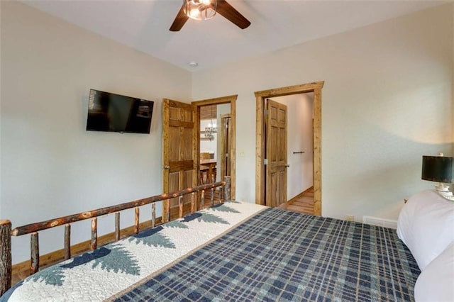 bedroom with ceiling fan and baseboards