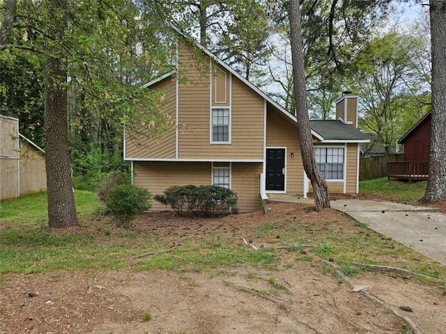 6301 Creekford Dr, Lithonia, GA 30058 - split level home featuring a chimney and fence