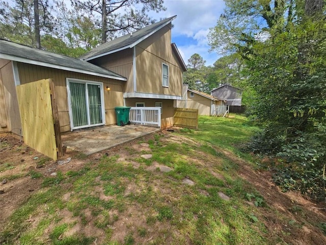 6301 Creekford Dr, Lithonia, GA 30058 - back of property featuring a patio area and a yard
