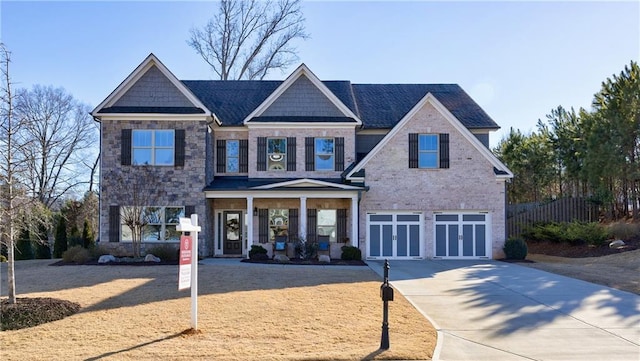 craftsman house with covered porch and a garage