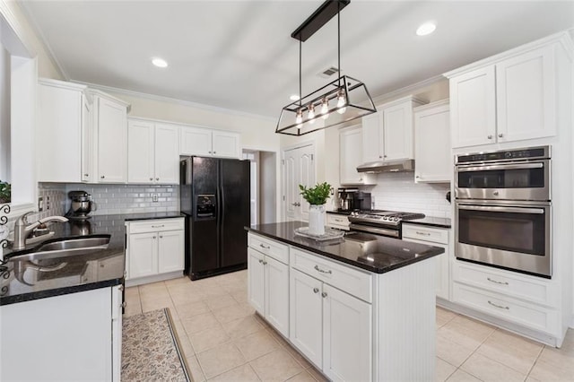 1125 Fairview Club Cir, Dacula, GA 30019 - kitchen with appliances with stainless steel finishes, under cabinet range hood, backsplash, white cabinetry, and recessed lighting