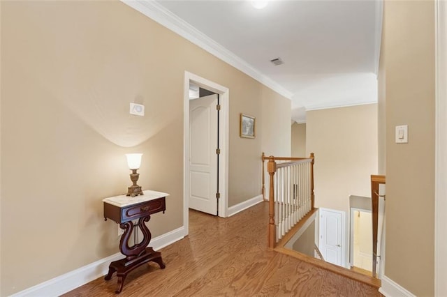 1125 Fairview Club Cir, Dacula, GA 30019 - hall with an upstairs landing, wood finished floors, and crown molding