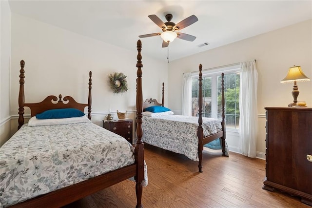 1125 Fairview Club Cir, Dacula, GA 30019 - bedroom featuring wood finished floors and ceiling fan
