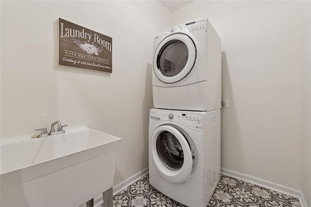 1125 Fairview Club Cir, Dacula, GA 30019 - laundry room with stacked washer and clothes dryer and light tile patterned floors