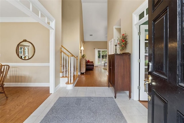 1125 Fairview Club Cir, Dacula, GA 30019 - entrance foyer with stairs, light tile patterned floors, and a towering ceiling