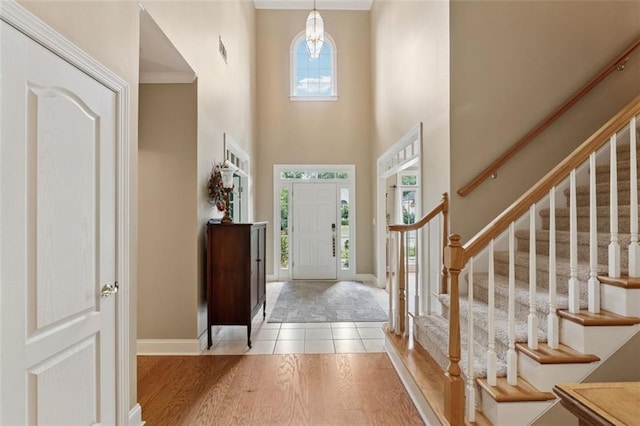 1125 Fairview Club Cir, Dacula, GA 30019 - foyer entrance featuring stairs, wood finished floors, and a high ceiling