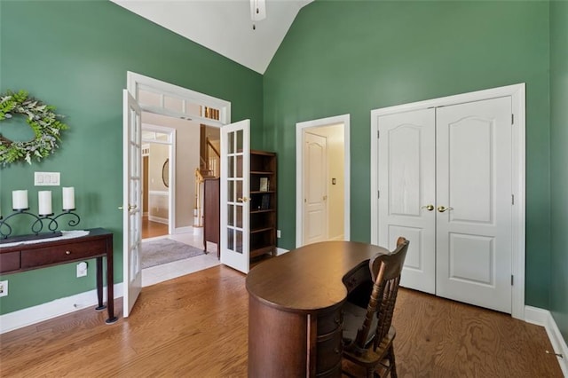 1125 Fairview Club Cir, Dacula, GA 30019 - office area featuring french doors, wood finished floors, high vaulted ceiling, and a ceiling fan