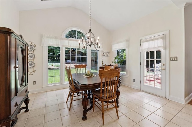 1125 Fairview Club Cir, Dacula, GA 30019 - dining area featuring lofted ceiling, plenty of natural light, light tile patterned floors, and a chandelier