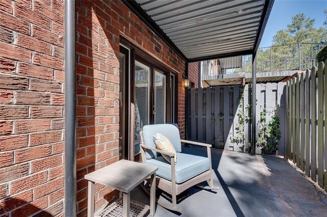 view of patio / terrace featuring fence