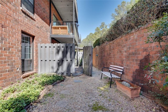 exterior space with fence and a balcony