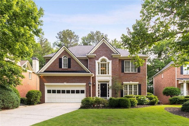4679 Glenshire Pl, Dunwoody, GA 30338 - view of front of property featuring concrete driveway, a garage, a front yard, and brick siding