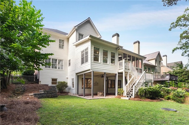 4679 Glenshire Pl, Dunwoody, GA 30338 - back of house with a chimney, a sunroom, ceiling fan, a patio area, and stairway