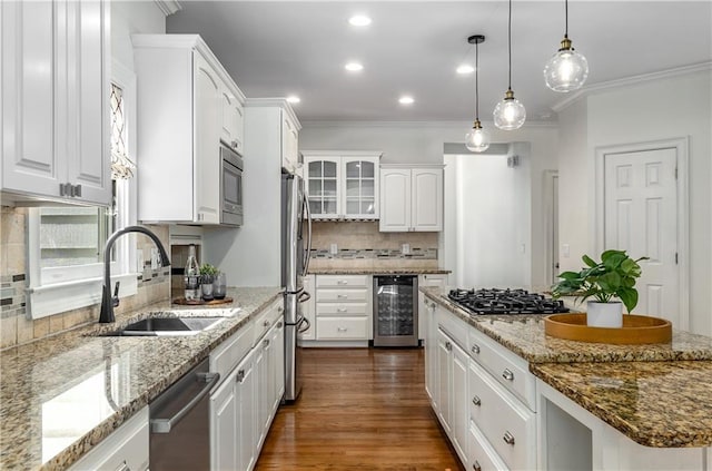 4679 Glenshire Pl, Dunwoody, GA 30338 - kitchen featuring a sink, beverage cooler, stainless steel appliances, white cabinetry, and decorative backsplash