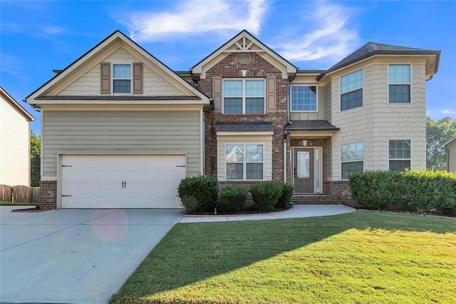 view of front of house featuring a front lawn and a garage