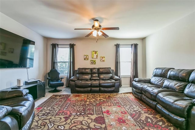 living room with ceiling fan and carpet flooring