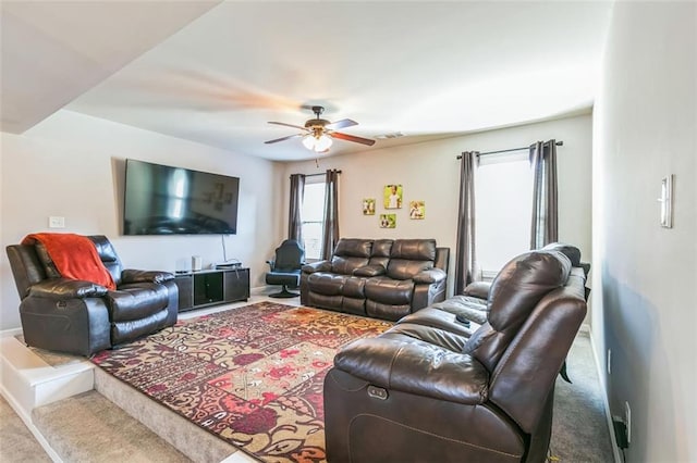 living room featuring ceiling fan and carpet flooring