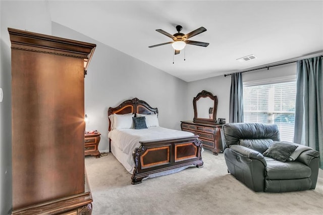 bedroom with carpet flooring, ceiling fan, and vaulted ceiling