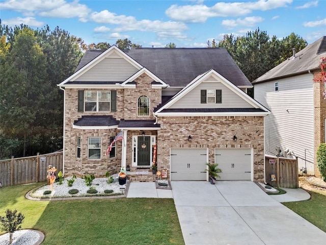 view of front of home featuring a garage, brick siding, fence, driveway, and a front yard