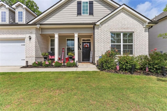 view of front facade with a front yard and a porch