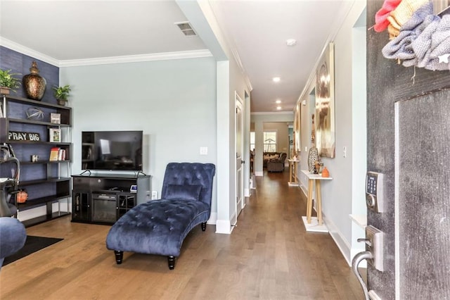 interior space featuring crown molding and hardwood / wood-style flooring