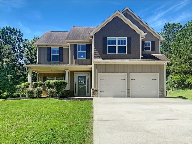 craftsman-style house with a garage and a front lawn