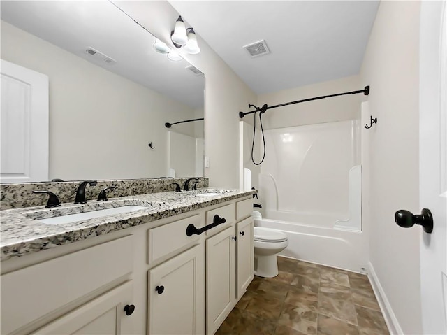 full bathroom with bathtub / shower combination, vanity, and toilet