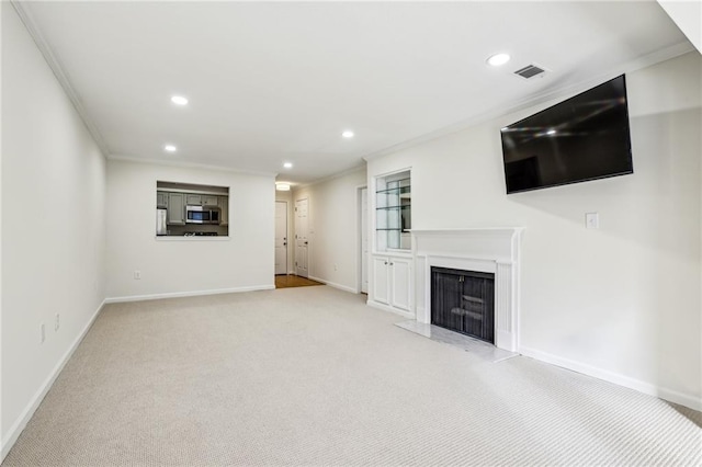 unfurnished living room featuring visible vents, crown molding, and recessed lighting