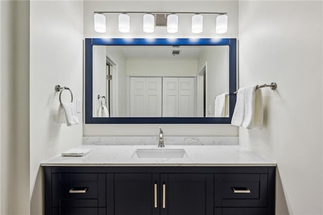 bathroom with visible vents and vanity