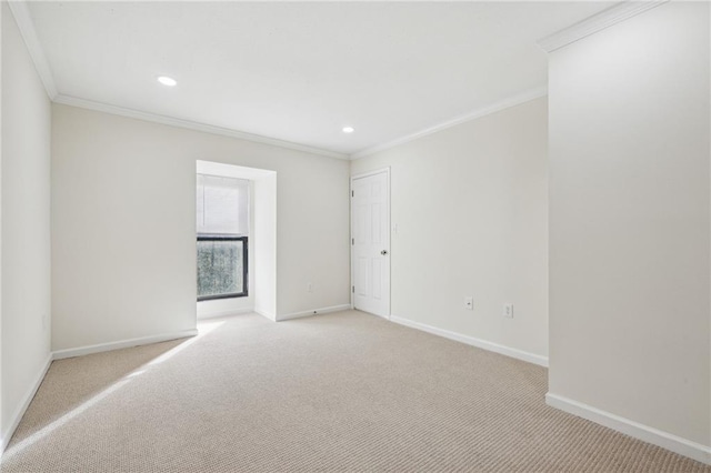 unfurnished room featuring light carpet, ornamental molding, recessed lighting, and baseboards