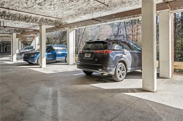 view of vehicle parking featuring a parking deck