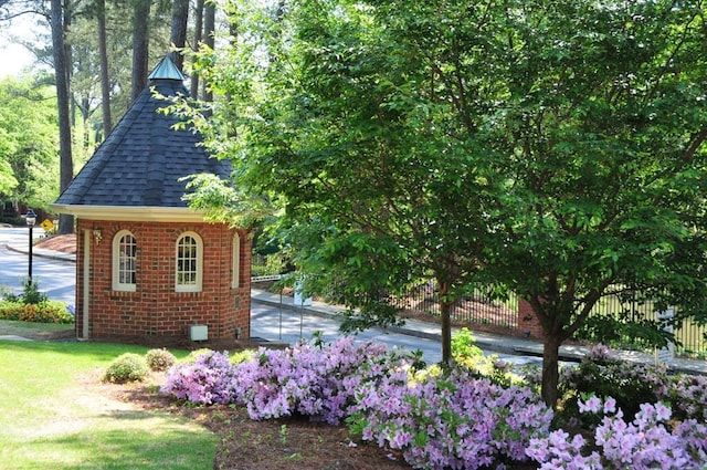 exterior space featuring fence and a yard