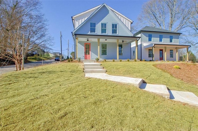 view of front facade with covered porch and a front lawn