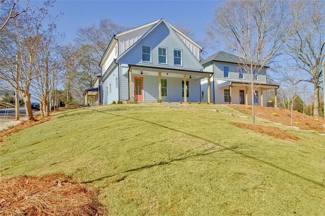 view of front of property featuring covered porch and a front lawn