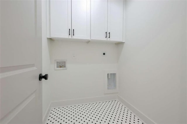 washroom with cabinets, electric dryer hookup, and washer hookup