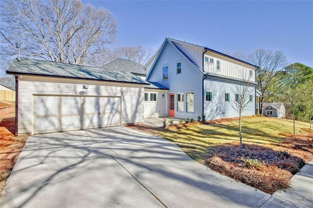 view of front of property with a garage and a front yard