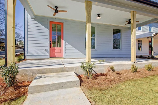 doorway to property with ceiling fan and a porch