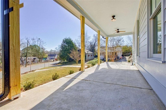 view of patio featuring ceiling fan