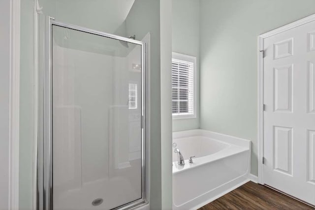 563 Bailey Dr, Jefferson, GA 30549 - full bathroom featuring a shower stall, a garden tub, and wood finished floors