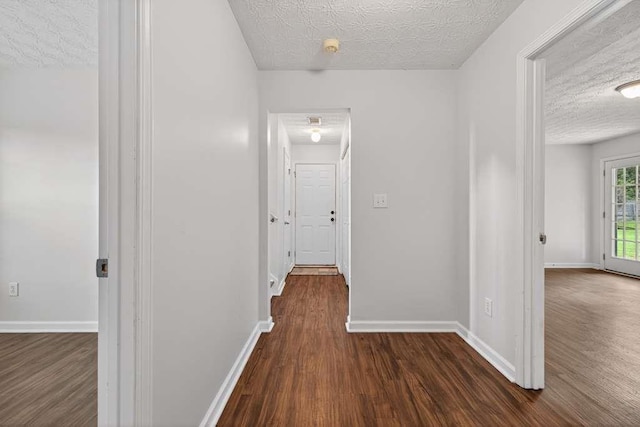 563 Bailey Dr, Jefferson, GA 30549 - hallway featuring dark wood-type flooring and a textured ceiling