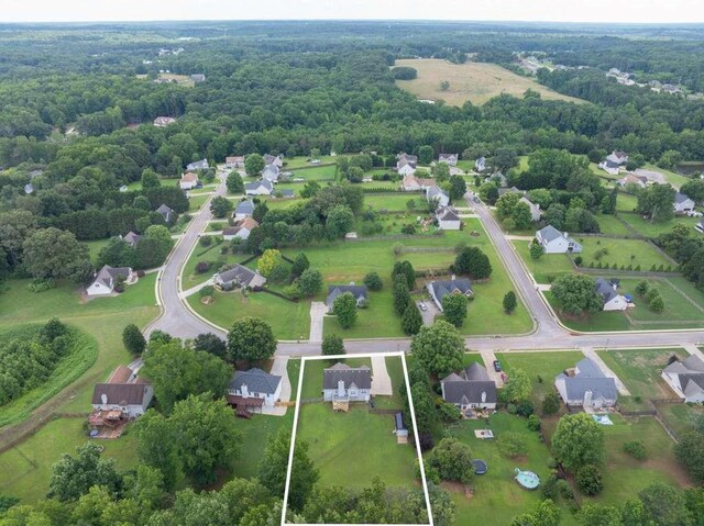 563 Bailey Dr, Jefferson, GA 30549 - aerial view of residential area featuring property boundaries highlighted and a forest