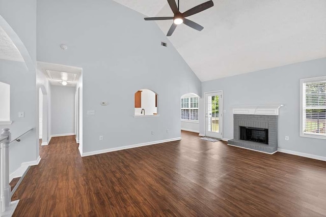 563 Bailey Dr, Jefferson, GA 30549 - unfurnished living room featuring high vaulted ceiling, a ceiling fan, attic access, dark wood-type flooring, and a brick fireplace